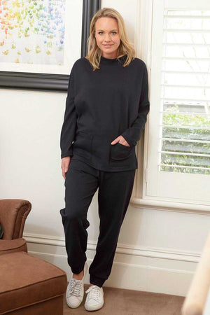 Stand neck long sleeve jumper with pockets in Navy over Navy jogger pants